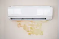 Water stain on wall due to leaking AC unit